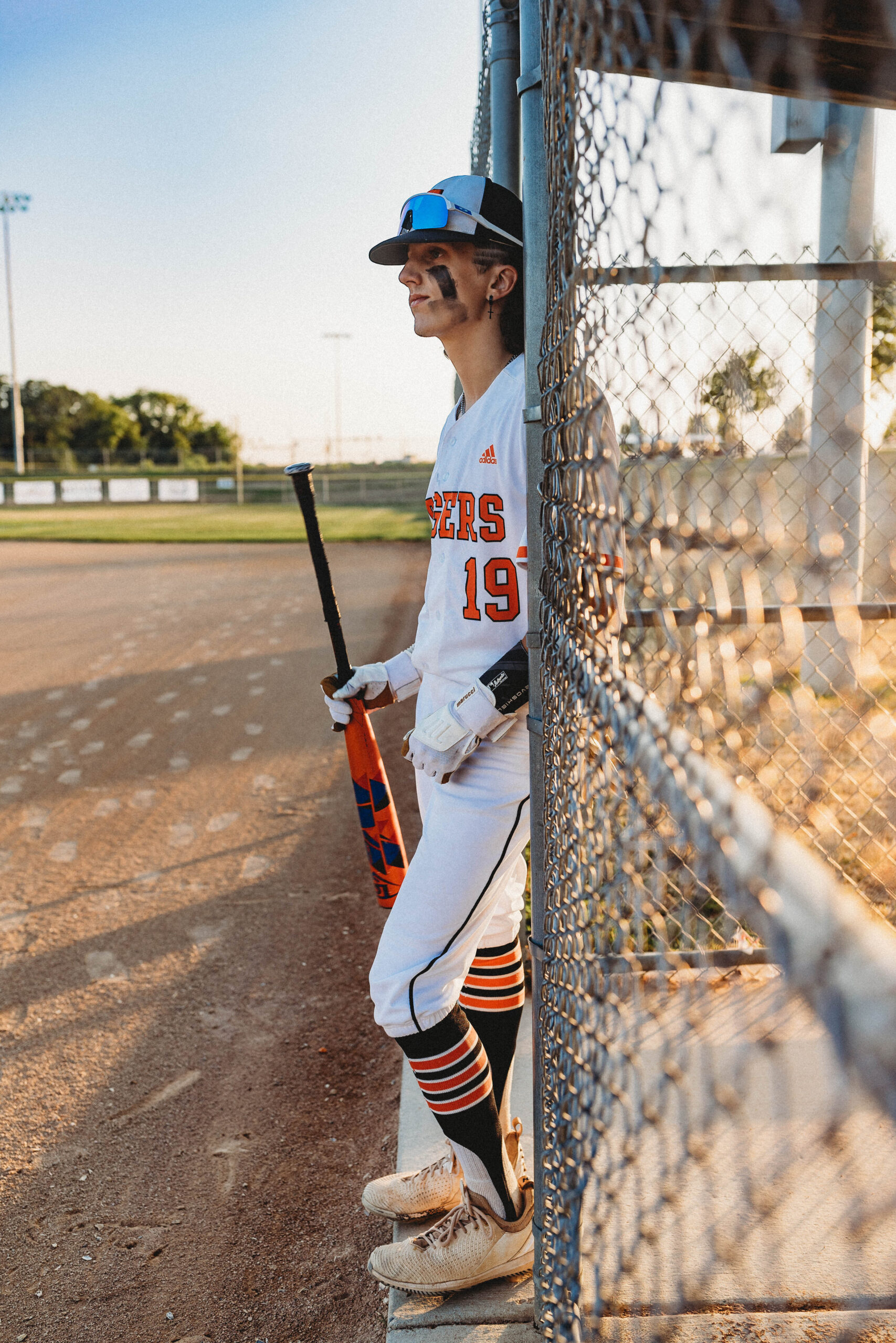 Waiting to his turn to bat.