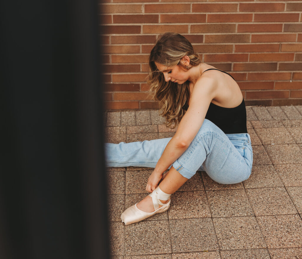 North Lakeville high school senior lacing up her dance shoes for her In Action photoshoot, captured by Tiffany Chesley Artistry, Minnesota Senior Photographer.