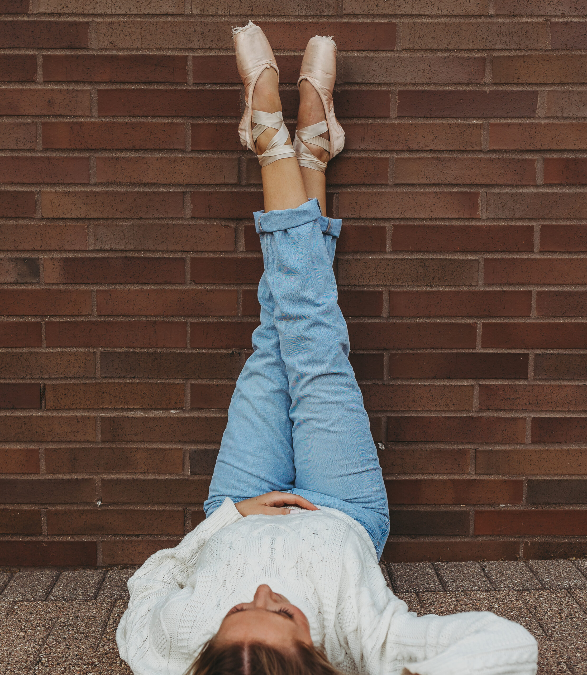 a dancer poses in her ballet flats