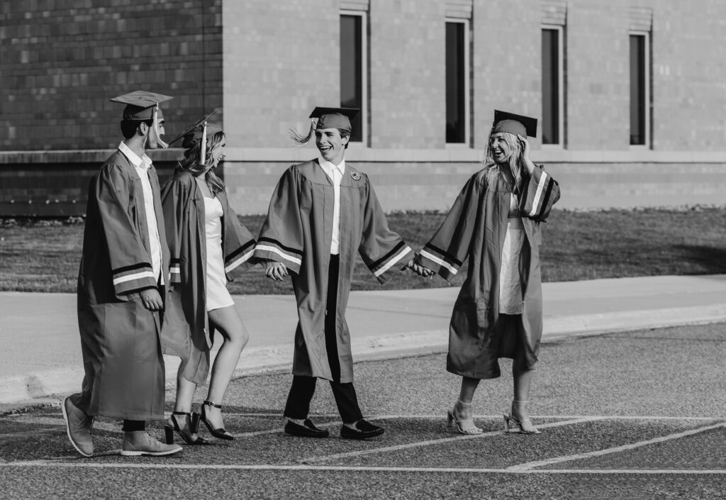 Group of North Lakeville high school seniors laughing and enjoying their group photoshoot, captured in a candid moment by Tiffany Chesley Artistry.